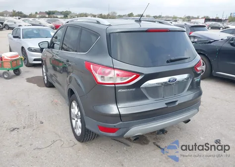 2016 Ford Escape Titanium z USA, uszkodzony, nr VIN 1FMCU0J99GUB82276